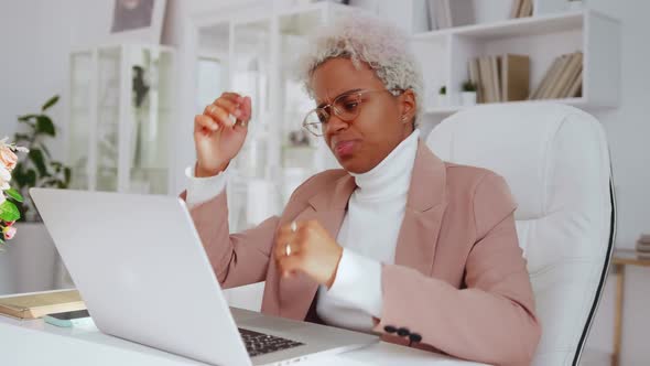 Upset African American Business Woman Using Laptop Doing Difficult Task