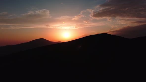 Aerial view of colorful sunrise on top of Carpathian Mountains range