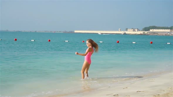 Happy Girl Enjoy Summer Vacation on the Beach