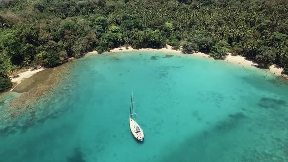 Drone footage of a sail boat at one of Panama's islands "Playa Blanca" located at Colon province.