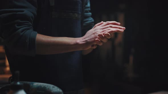 Cinematic Video Closeup of Male Hands Shake Off Dust and Shavings