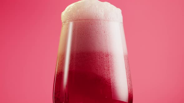 Foamy Cherry Beer in Glass Closeup Belgian Lambic