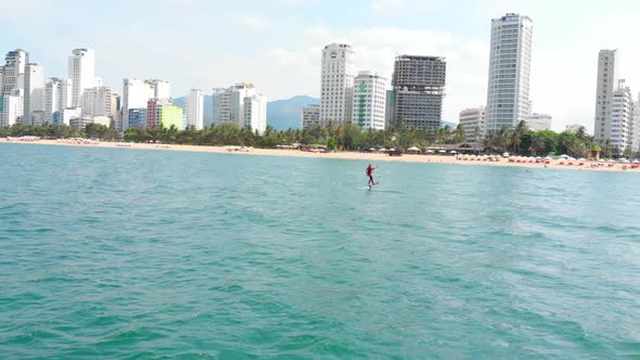 Acrobatic Jump of Professional Kite Surfer on the Sea Wave, Athlete Showing Sport Trick Jumping with