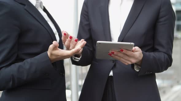 Cropped Shot of Businesswomen Using Tablet Pc