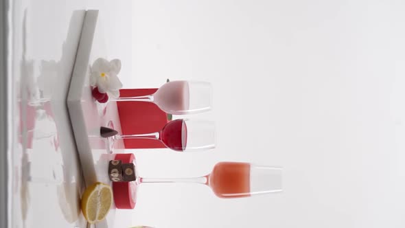 Vertical video, Close-up: a composition of several glasses of alcohol stands