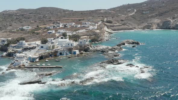 Wide Establishing Shot of Greek Fishing Village Build Right By the Ocean