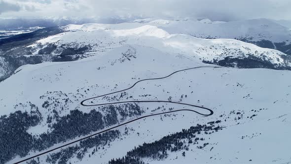 Storm brewing over the peaks on Loveland Pass, Colorado. Aerial views of mountains and highway 6.