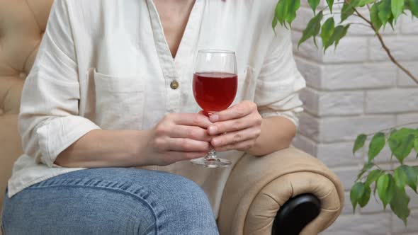 Relax in Armchair with Wine