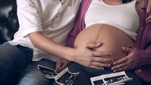 Pregnant Couple Feels Love and Relax at Home