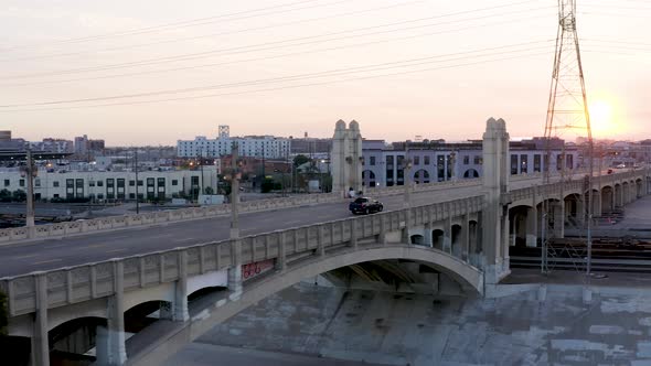 Urban Concept - Car Driving in Scenic DTLA City Landscape at Sunset. Aerial Drone Reveal