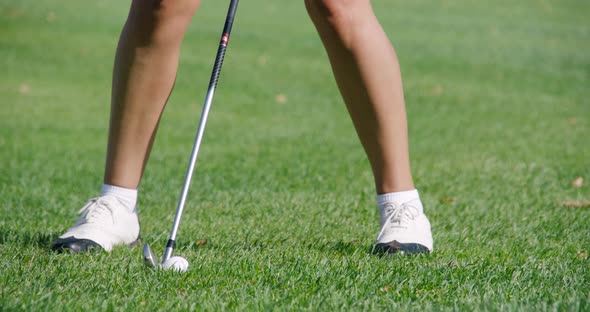 Green Park, Woman Playing Golf, Hits the Ball, View of the Legs From the Lower Angle, Golf Course in