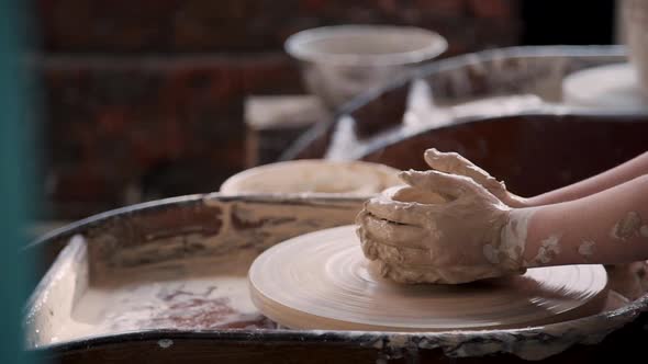 Manufacture Master Working with Clay in Pottery Studio