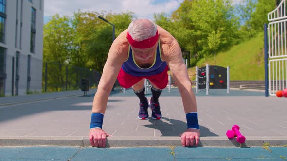 Senior Man Grandfather 80 Years Old Doing Sport Cardio Training Pushups Exercising on Playground