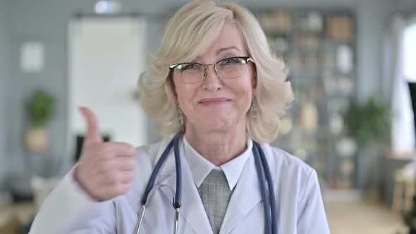 Portrait of Old Female Doctor Doing Thumbs Up