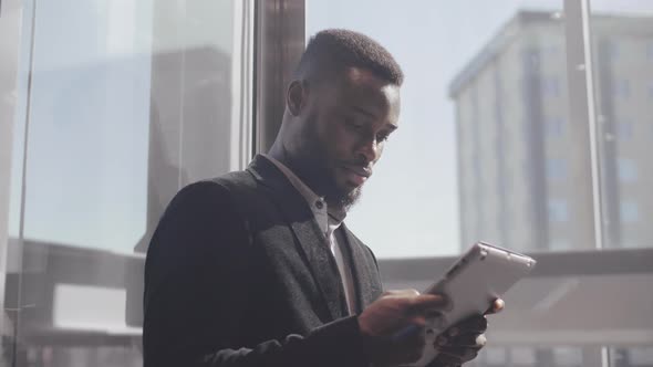 Trader Using Tablet in Elevator