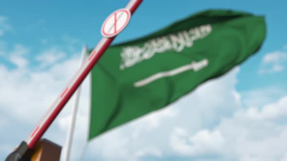Closed Gate with STOP CORONAVIRUS Sign on Saudi Arabian Flag Background