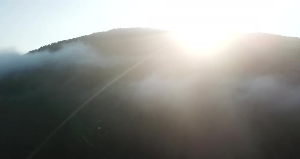 Epic Aerial Flight Over Clouds Mist Forrest Sunset