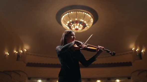 Professional Female Violinist is Playing Violin on Scene of Opera House Portrait of Soloist in