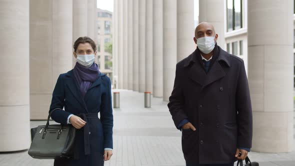 Business Colleagues in Safety Mask Standing Outdoors Office Building Keeping Social Distancing