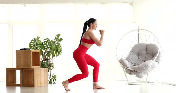 Young woman doing sports, fitness at home.