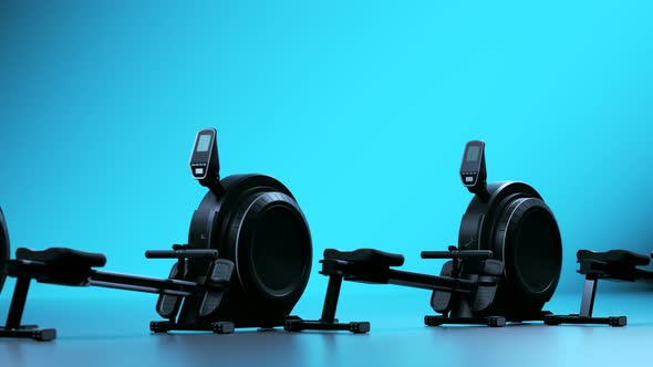 Rowing Machines or ergometers Isolated on blue background. Cardio workout.