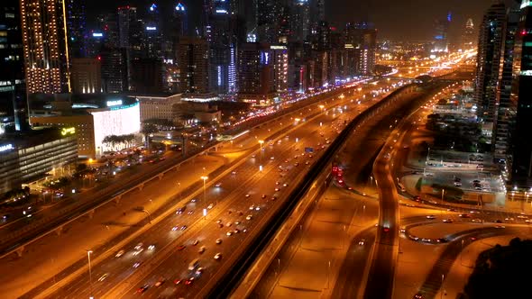 Aerial hyperlapse of a busy highway in Dubai at night, U.A.E.