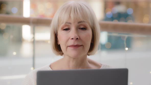 Headshot Focused Successful Mature Businesswoman Entrepreneur Working on Laptop Typing Article