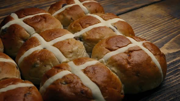 Passing Hot Cross Buns On Wooden Table