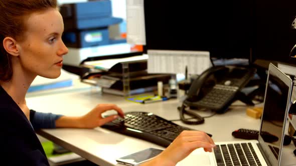 Female executive working at desk