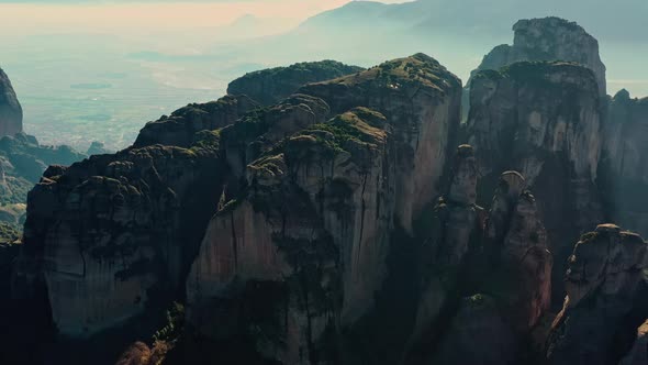 Aerial View of UNESCO Monument Meteora the Mountains the Landmark of Greece Fog Haze Over a Valley