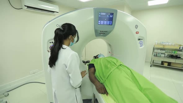 Female Radiologist Operates A Ct Scanner