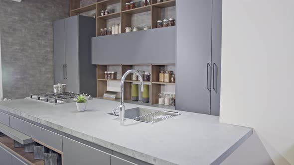 Tracking shot of a luxury kitchen with gray modern design