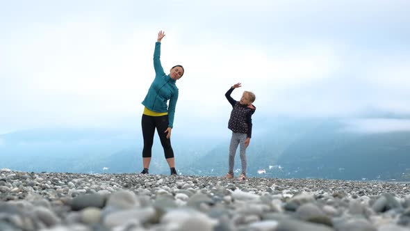 Little Girl with Mother Doing Morning Workout