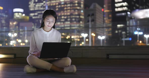 Business woman use of notebook computer at outdoor