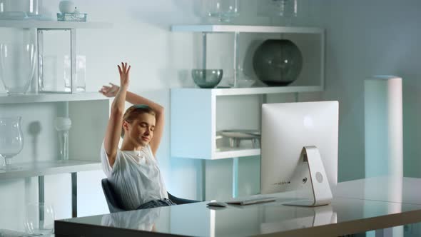 Attractive Businesswoman Stretching Body Home Office