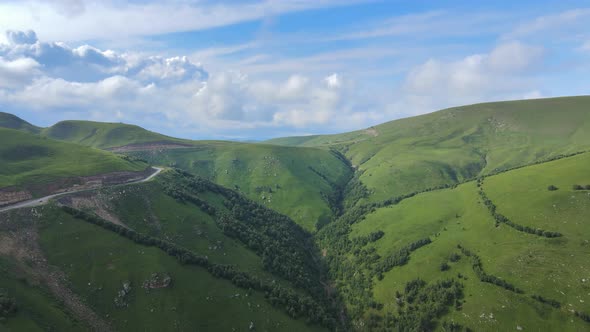 View of the Green Caucasus Mountains in Summer From the Sky