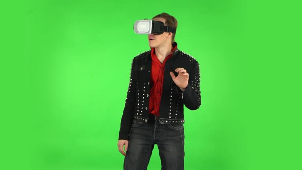 Guy with Virtual Reality Headset or 3d Glasses. Green Screen