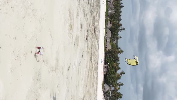 Vertical Video Kitesurfing Near the Shore of Zanzibar Tanzania Aerial View