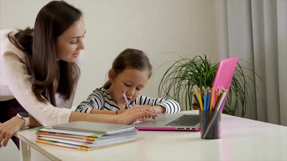 Mother and Daughter Doing Homework Together