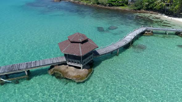 Aerial of gazebo on a dock out in the ocean on a tropical island, Koh Kood, Thailand