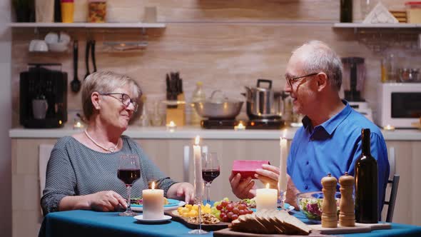 Senior Man Giving Gift To Wife