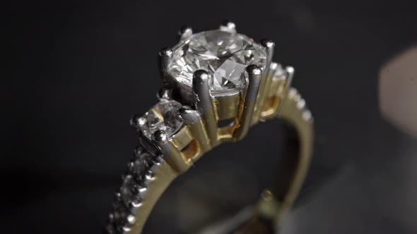 Extreme Detailed of Diamond Ring Close Up Shot While Rotating on Dark Background
