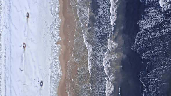 Fishing boats on beach at winter. Baltic sea in winter