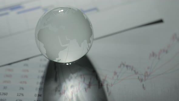 Glass globe with stock charts