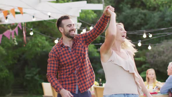 Young couple dancing outdoors