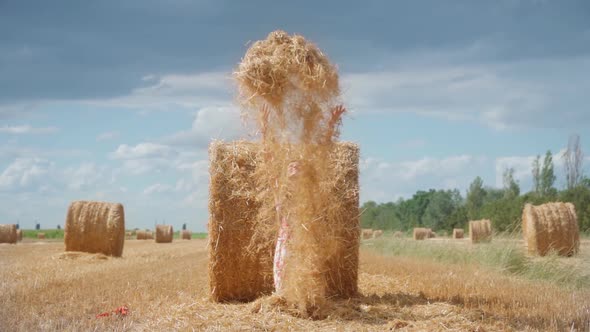 Girl Throws Hay Into the Sky in Slow Motion