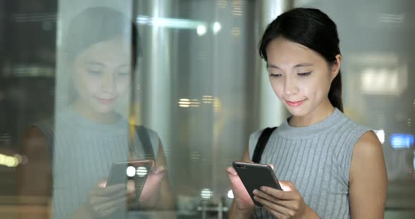 Woman use of smart phone in city 