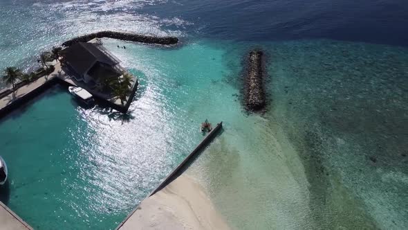 Aerial View of a Tropical Paradise Island Bay Covered in Limestone Trees with Crystal Clear Beach