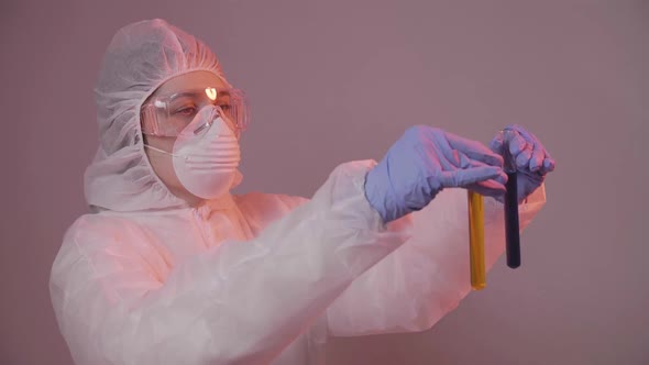 Protected Scientist Pouring Liquid in a Laboratory. Research and Science Concept