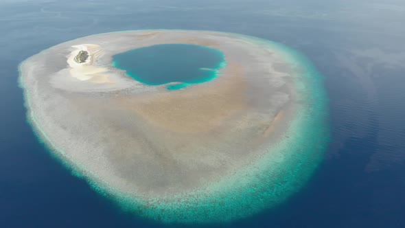 Aerial: Flying over idyllic atoll, Wakatobi Marine National Park Indonesia